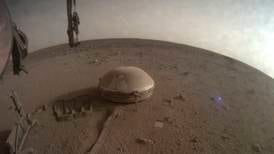 InSight craft powers down on Mars due to dust coating on solar panels