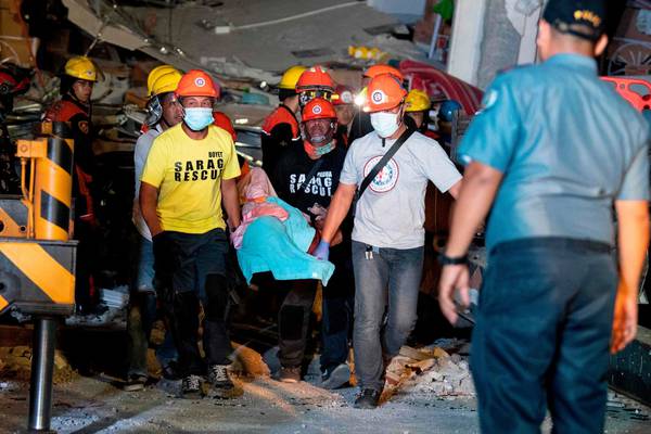 Philippines earthquake: at least eight dead and dozens trapped in rubble