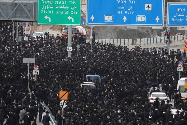 Thousands flout Israel’s Covid-19 restrictions to attend rabbi’s funeral