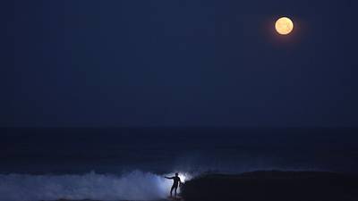 Irish among San Diego surfers catching waves beneath the stars