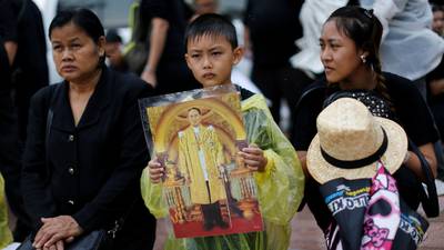 Thais brave Bangkok rain for mass mourning of king