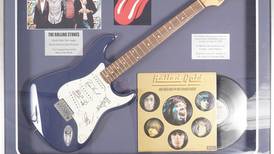 Guitar signed by the Rolling Stones expected to sell for about €3,000