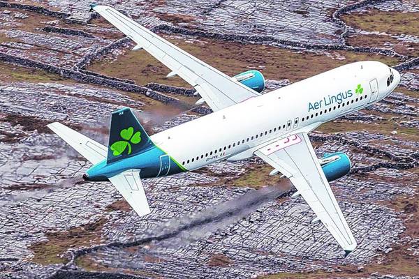 Losses at Aer Lingus parent more than halve as travel resumes