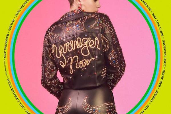 Miley Cyrus puts away the wagging tongue and pulls on her cowboy boots