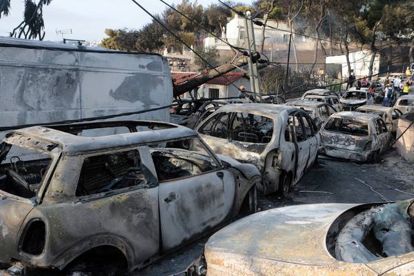 Greek seaside town remembers lives lost to wildfire
