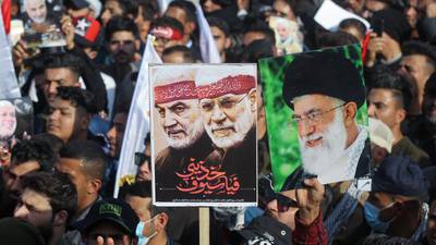 Iraqis chanting anti-US slogans mark year since killing of Soleimani