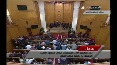 Mansour sworn in as head of interim government