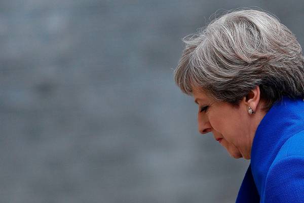 A humiliated Theresa May staggers on