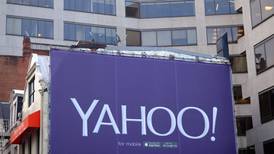 Yahoo signs ad pact with Google; earnings and revenue miss