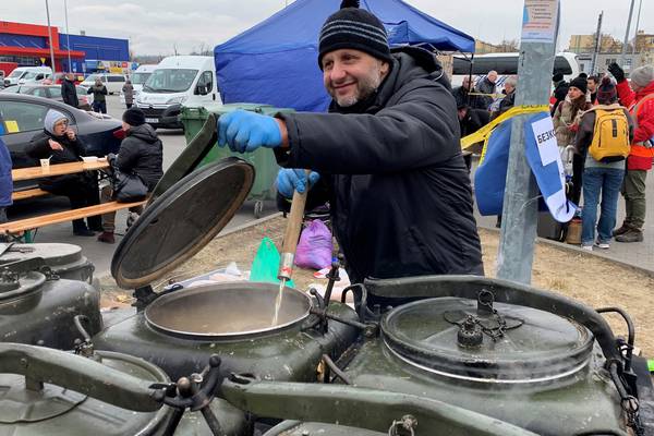 ‘This is from the bottom of my heart’: Polish volunteers line up to help Ukrainian refugees