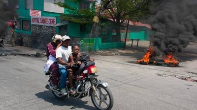 Haiti suspected gang members set on fire as conflict spreads to capital suburb