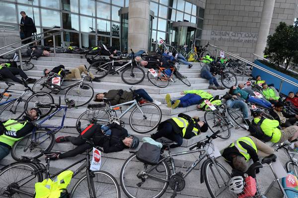 Cyclists stage ‘die-in’ protest outside Dublin City Council office