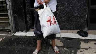 Retailer H&M feels the pinch as strong dollar boosts costs