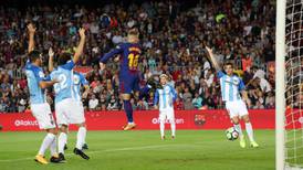 Controversial Deulofeu goal helps Barca beat Malaga