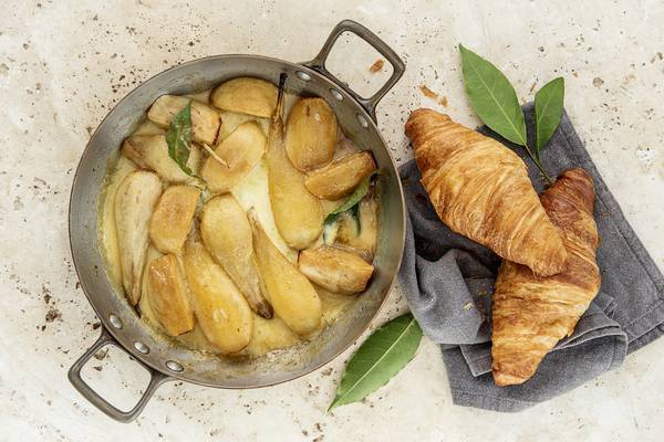 Apples and pears with brown sugar, cream and hot croissants