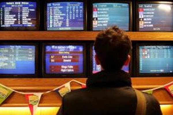 William Hill reports profit at bottom of guidance range