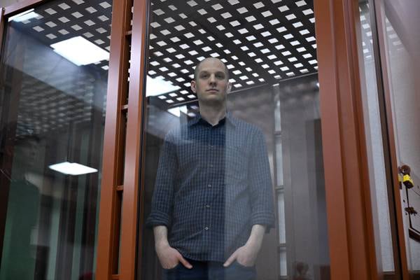 Journalist Evan Gershkovich appears in court with shaved head as Russian espionage trial begins