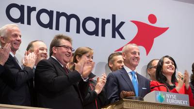Aramark grows sales but interest bill pushes it into the red