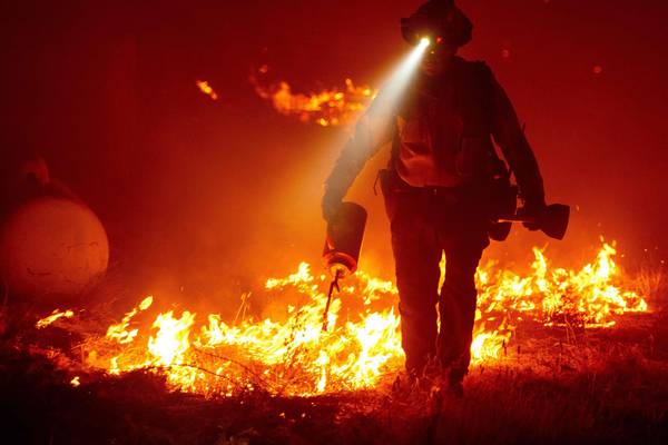 California wildfires: Three dead, 64,000 on verge of evacuation