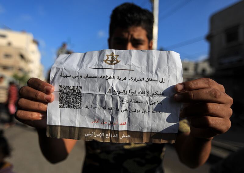  A leaflet dropped by Israeli aircraft in the eastern areas of Khan Younis, in the southern Gaza Strip. Photograph: Yousef Masoud/New York Times
                      