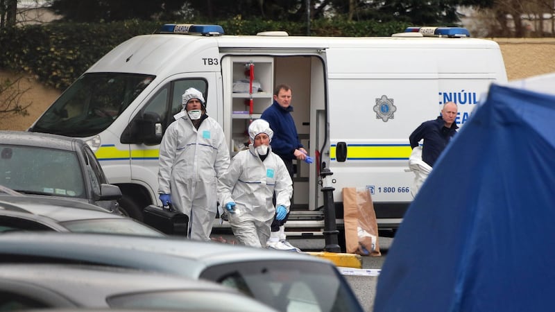 Gardaí outside Cumiskey’s pub on Blackhorse Avenue on December 31st, 2015, after Darren Kearns was shot dead the previous  night in the car park. File photograph: Colin Keegan/Collins Dublin