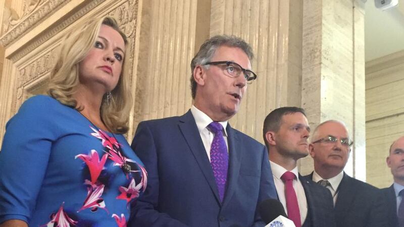 UUP leader Mike Nesbitt (centre): The formation of an official opposition “heralds a new era for devolved politics at Stormont, and a big, bold step forward to normal democracy for Northern Ireland”.  Photograph: David Young/PA Wire