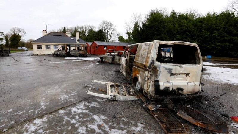 Burnt-out vans and cars in the yard of the house which was the scene of an eviction in Strokestown last week. Photograph: Brian Farrell