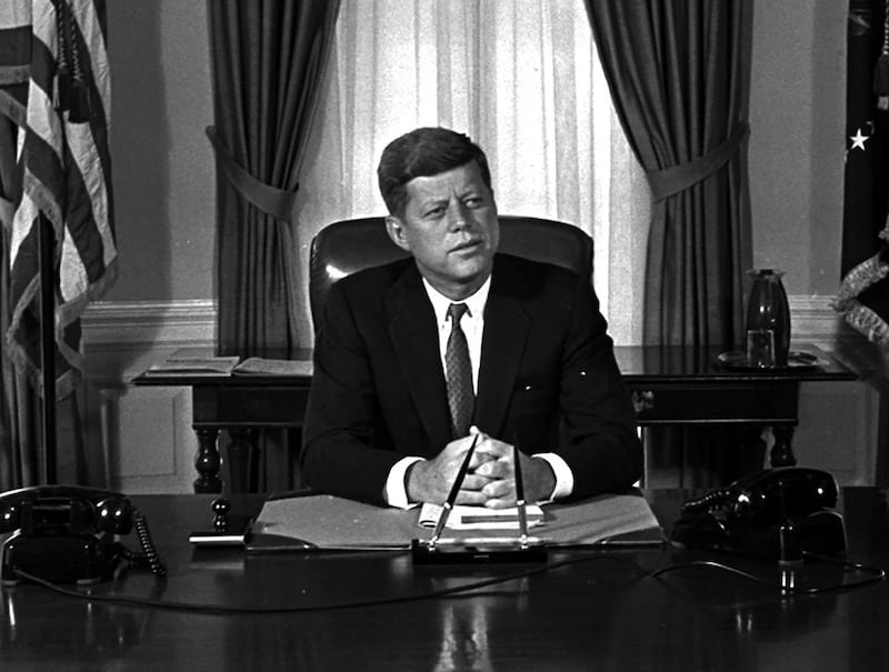 Newly-elected president John F Kennedy poses for the first pictures at his White House desk on January 21st, 1961. Potograph: Bill Achatz/AP