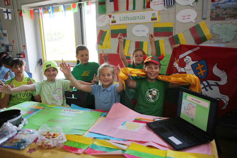 Martin Jagtybskas (fifth class) and fellow Lithuanian schoolmates celebrate International Day at Bunscoil McAuley Rice which is a School of Sanctuary. Photograph: Bryan O'Brien