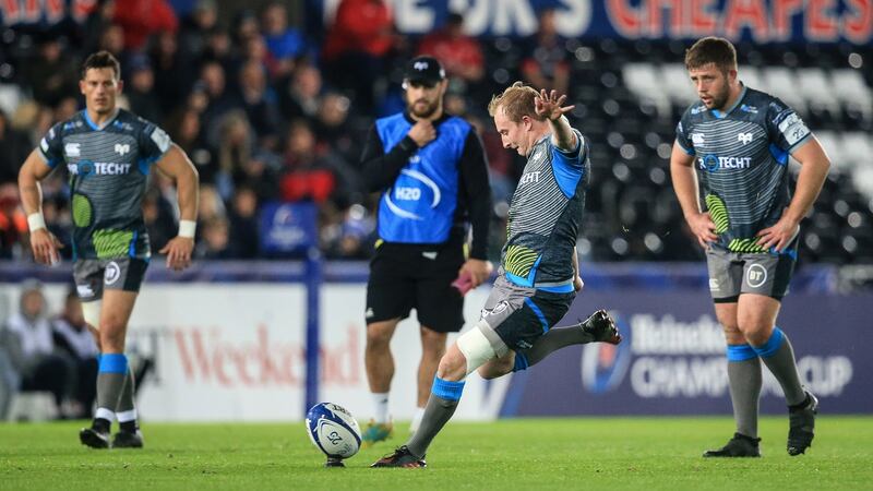 Ospreys’ Luke Price kicks a penalty against Munster. Photograph: Gary Carr/Inpho