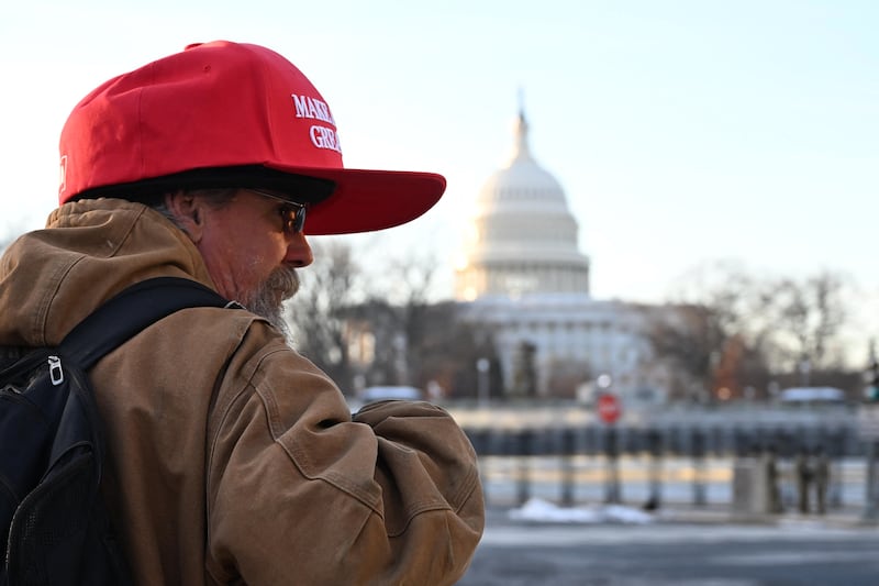 A man wears a Make America Great Again hat near the US Capitol on the day Donald Trump is inaugurated president of the United States. Photograph: Alex Wroblewski/ AFP