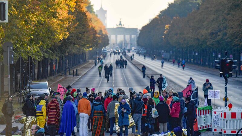 Protesters block one of the roads around the Victory Column (Siegessaeule) to mark the beginning of the Extinction Rebellion protests in Berlin, on October 7th, 2019. Photograph: Tobias Schwartz/AFP.