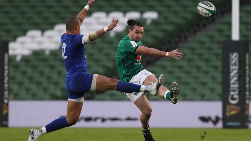 Ireland winger James Lowe clears the ball as France’s  Gael Fickou attempts to block during the Six Nations game at the Aviva Stadium. Photograph:  Brian Lawless/PA Wire