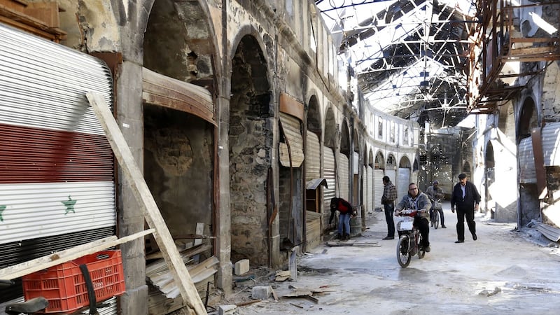 Damaged shops in the covered market in the old city of Homs. Photograph: AP Photo