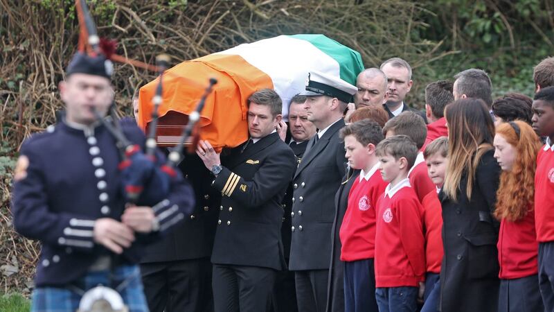 A piper and guard of honour accompany the coffin carrying  the remains of  Capt Mark Duffy at St Oliver Plunkett Church, Blackrock, Co Louth, this morning, where his funeral Mass was held.  Photograph: Colin Keegan/Collins Dublin