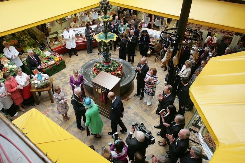 Lord Mayor of Cork City Cllr Michael O Connell  watches as  Queen Elizabeth unveils a plaque at  the English Market in Cork City on the final day of the Royal Visit to Ireland in 2011. 
Photograph: Alan Betson       

