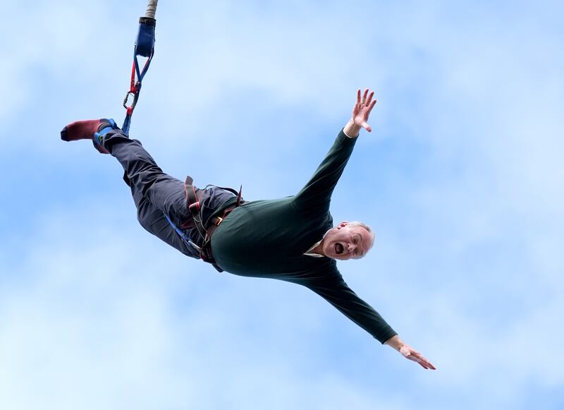 Liberal Democrat leader Ed Davey doing a bungee jump during a visit to Eastbourne Borough Football Club in East Sussex while on the campaign trail. Photograph: Gareth Fuller/PA Wire