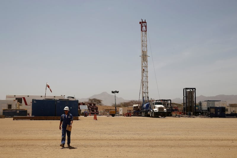 FILE PHOTO: A worker walks at a Tullow Oil explorational drilling site in Lokichar, Turkana County, Kenya, February 8, 2018. REUTERS/Baz Ratner/File Photo FILE PHOTO: A worker walks at a Tullow Oil explorational drilling site in Lokichar, Turkana County, Kenya, February 8, 2018. REUTERS/Baz Ratner/File Photo