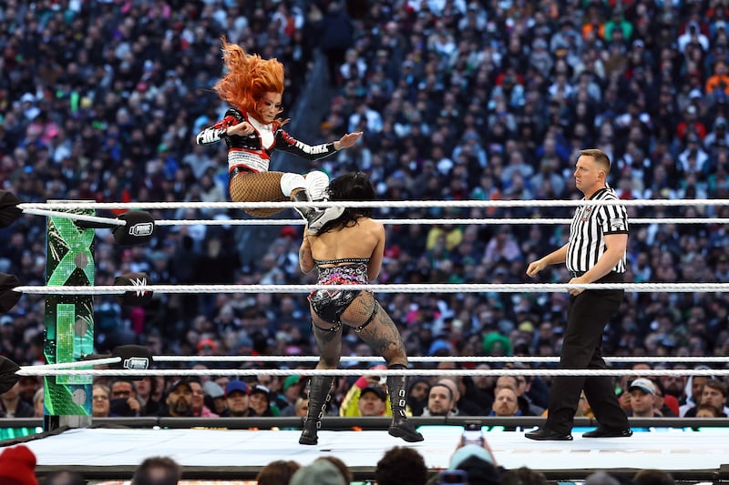 Becky Lynch fights Rhea Ripley during a match for the WWE Women's World Championship. Photograph: Tim Nwachukwu/Getty