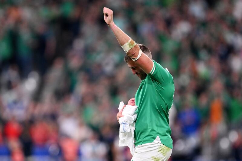 Stuart McCloskey of Ireland celebrates victory with his new-born child Kasper. Photograph: Laurence Griffiths/Getty Images