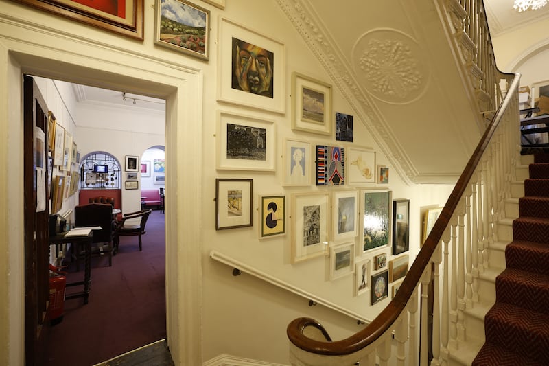 United Arts Club: The repainted stairwell displays artwork donated by members. Photograph: Nick Bradshaw