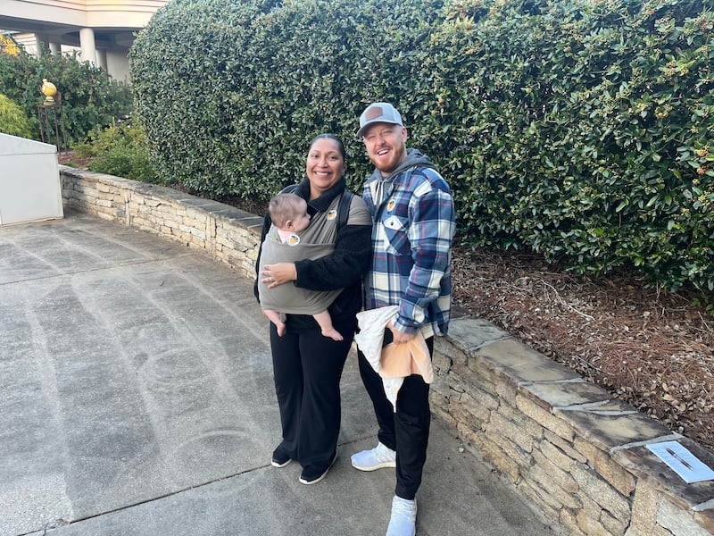 Kris and Thalia brought their four-month-old daughter Soleil when they went to vote at Dunwoody library in Atlanta, Georgia. Photograph: Steven Carroll