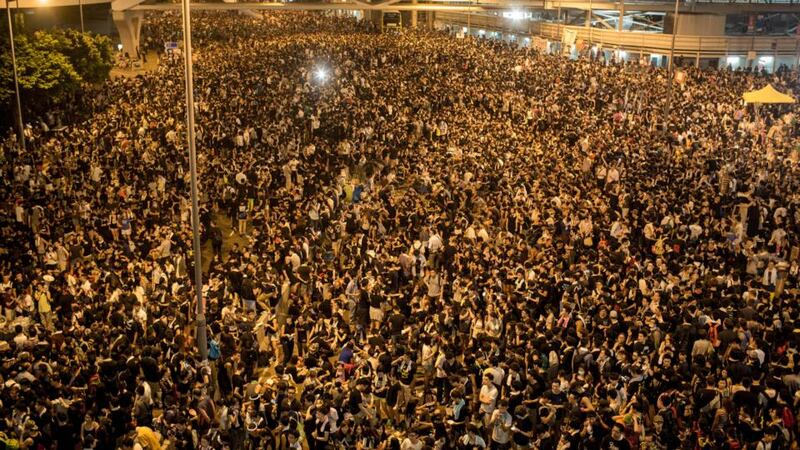 Protesters gather in the streets outside the Hong Kong Government Complex Monday. Thousands of pro democracy supporters have remained in the streets of Hong Kong for another day of protests. Protestors are unhappy with Chinese government’s plans to vet candidates in Hong Kong’s 2017 elections. Photograph: Chris McGrath/Getty Images