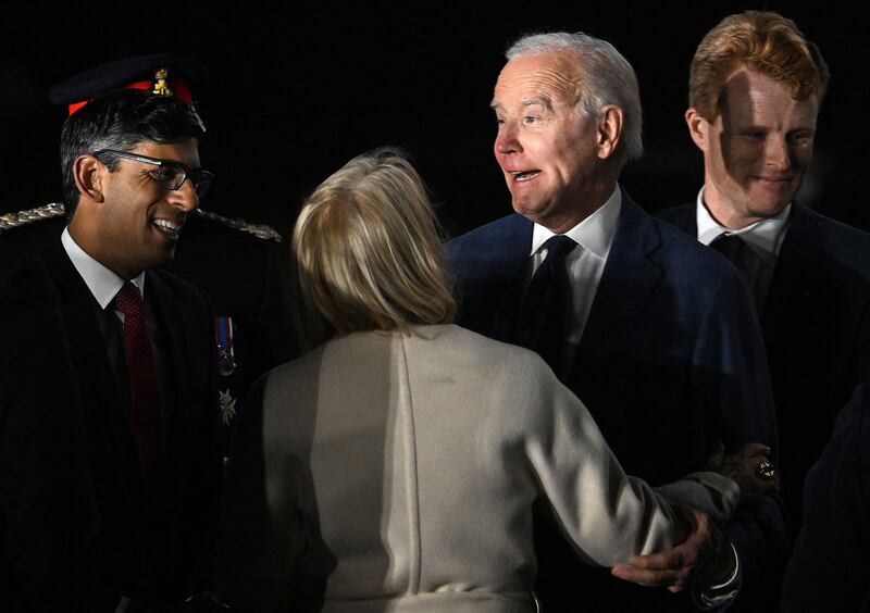 US president Joe Biden reacts as he is greeted by UK prime minister Rishi Sunak after disembarking from Air Force One on Tuesday night. Photograph: Jim Watson/AFP