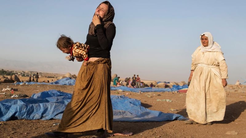 Iraqi Yazidis who have come from the Sinjar mountains arrive at a refugee camp in Derik in Syria. Photograph: Adam Ferguson/The New York Times