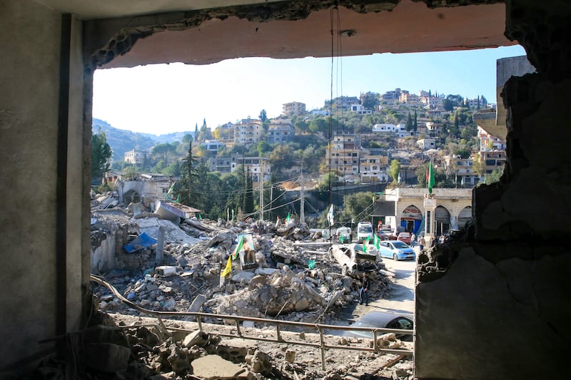 The portrait of a fighter killed during the war between Israel and Hizbullah amid the rubble of a destroyed building in the southern Lebanese village of Khirbet Selm near the border with northern Israel on December 3rd. Photograph: Mahmoud Zayyat/AFP via Getty