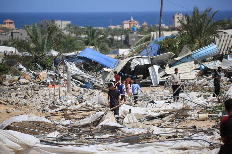 People look for salvageable items following an Israeli raid in Rafah on June 29th. Photograph: Eyad Baba/AFP via Getty