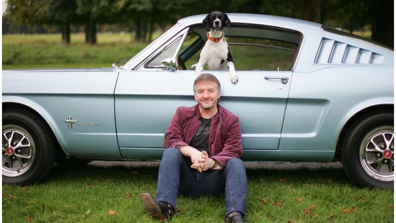 Writer John Connolly, his dog and his Ford Mustang. Photograph: Bryan O'Brien