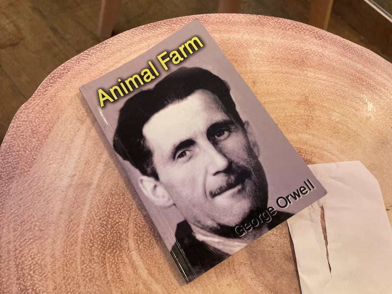 Waiter Muhammad's copy of George Orwell’s Animal Farm. Photograph: Hannah McCarthy