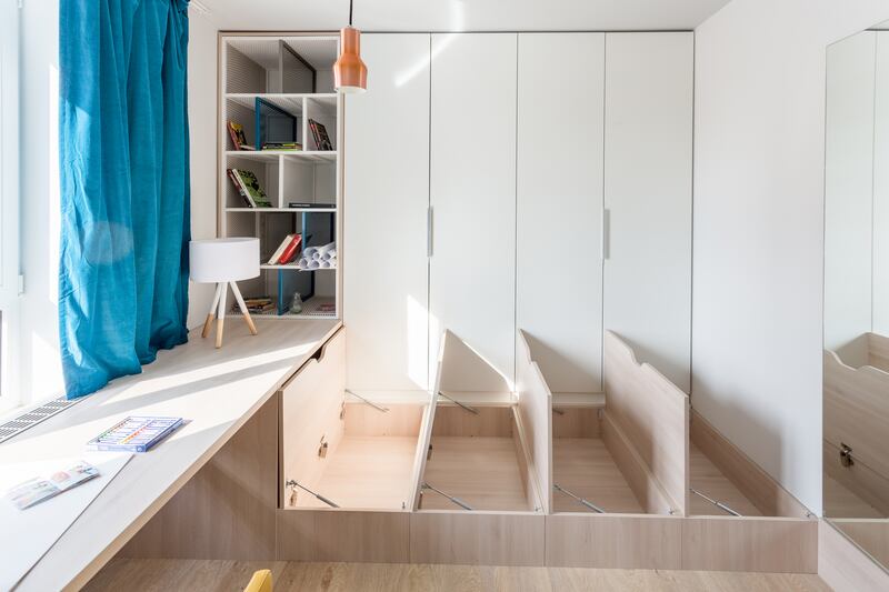 Built-in floor storage in a 42sq m (138sq ft) apartment in Prague. Photograph: Radu Sandovici Vertizontal Photography